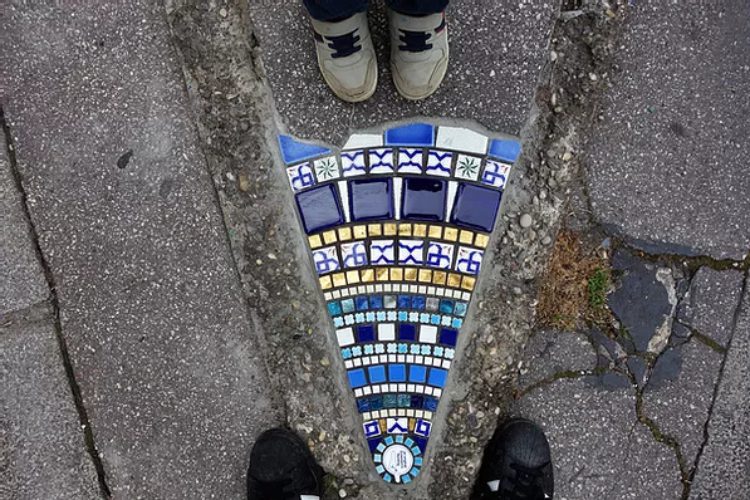 Artist Fixes Cracked Sidewalks and Potholes With Mosaics